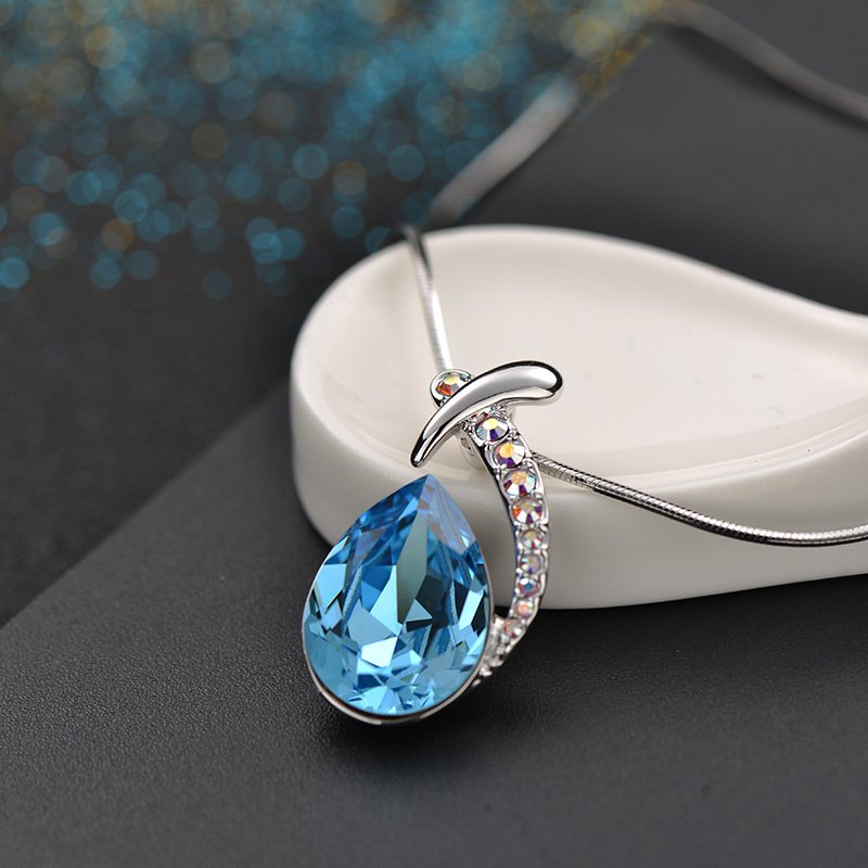 the diamond studded crystal pendant necklace features an austrian crystal mermaid fish necklace the diamond studded crystal pendant necklace features an austrian crystal mermaid fish necklace
