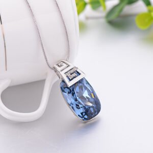 cowboy blue square crystal necklace with a three dimensional geometric pendant, sweater chain, collarbone chain