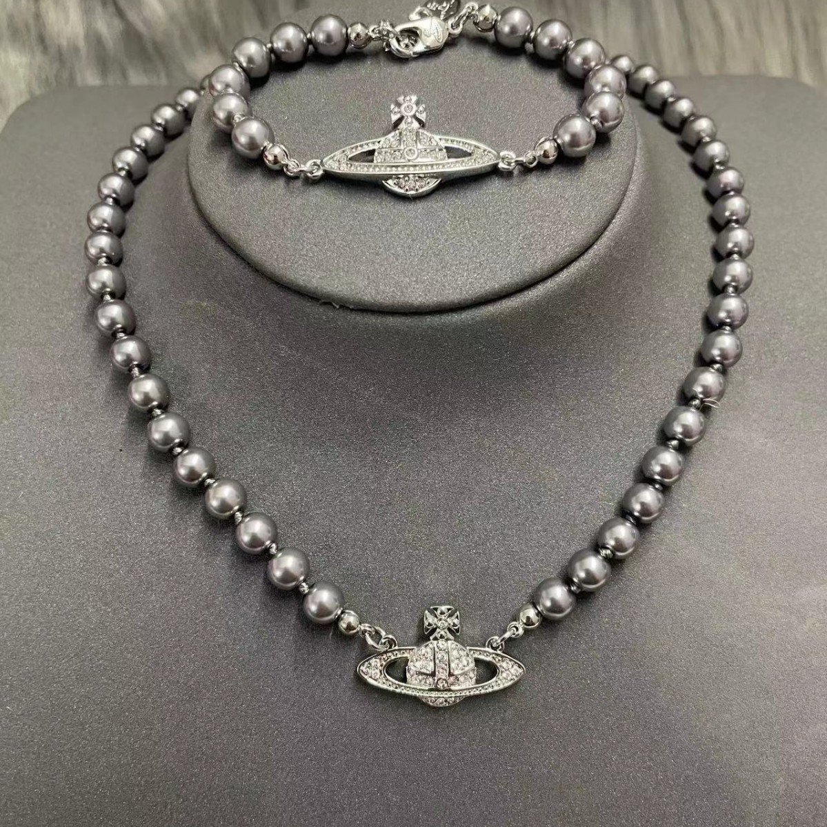 saturn grey pearl necklace and bracelet saturn grey pearl necklace and bracelet